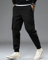 Model wearing black colour cargo pant with white sneakers 