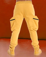 Model wearing yellow cargo pant with yellow sneakers