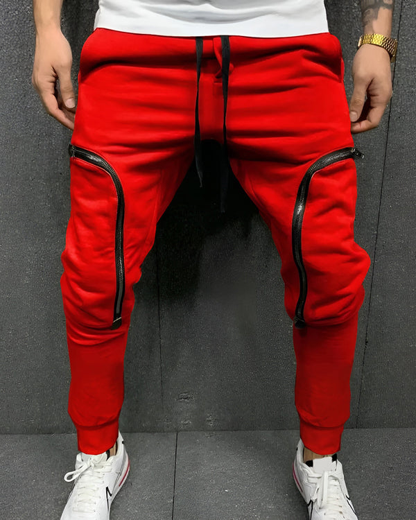 Model wearing zip pocket red cargo pant with white sneakers