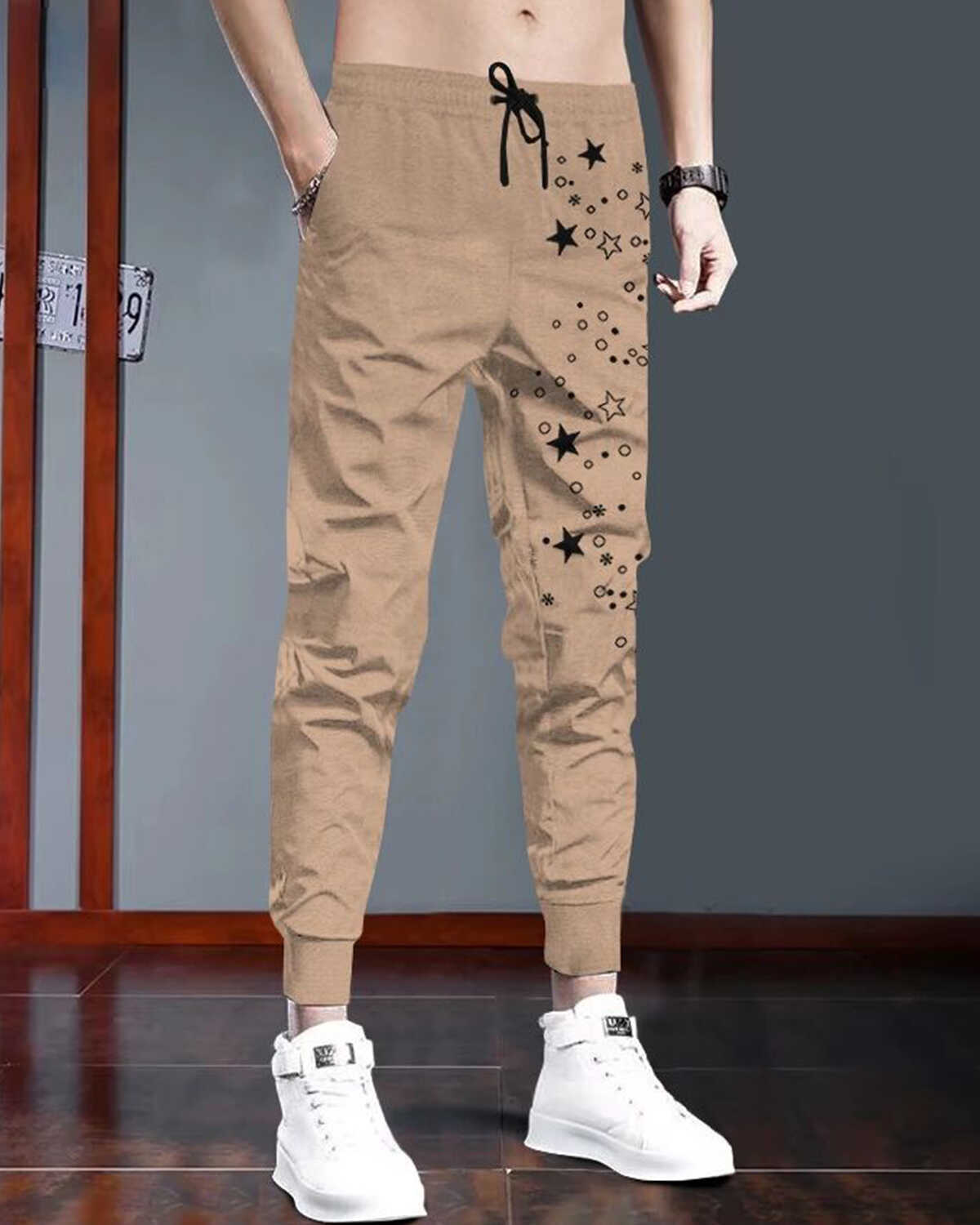 Men Beige & Black Star Printed Cuffed Trackpant