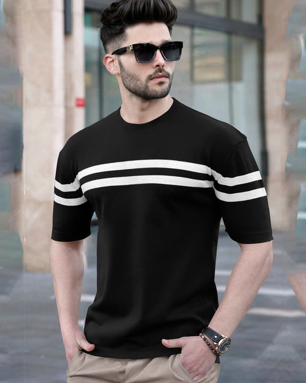 model wearing white vertical striped black round neck men's t shirt with shady coolers and hand watch