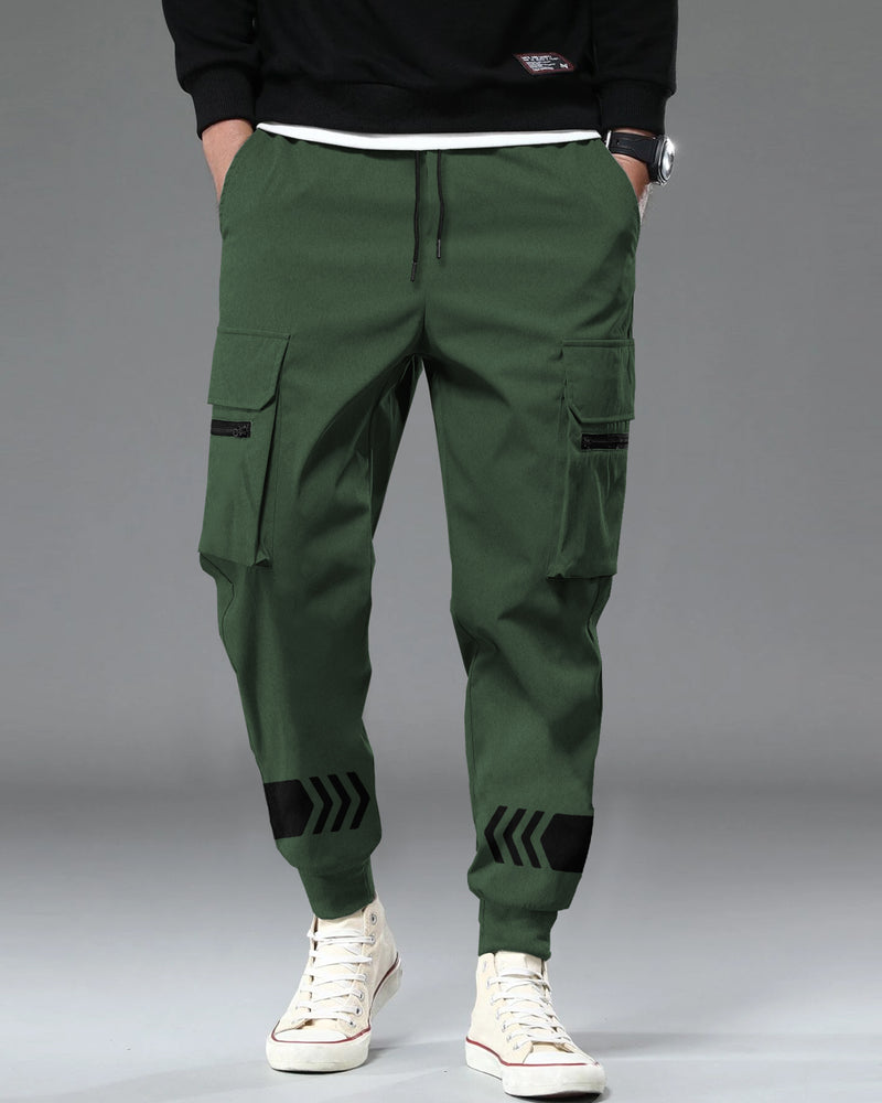 Model wearing olive green color cargo pant with white sneakers