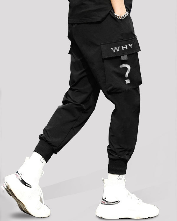 Model wearing why word printed black cargo pant with white sneakers