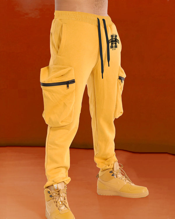 Model wearing hollywood printed yellow cargo pant with yellow sneakers