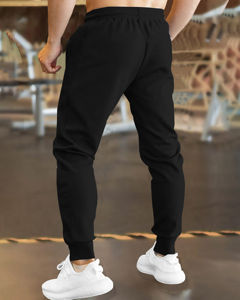 Men Solid Black TrackPant with Cuffed Ankles