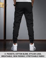 Men Solid Black Elastic Cuffed Ankles Drawstring TrackPant