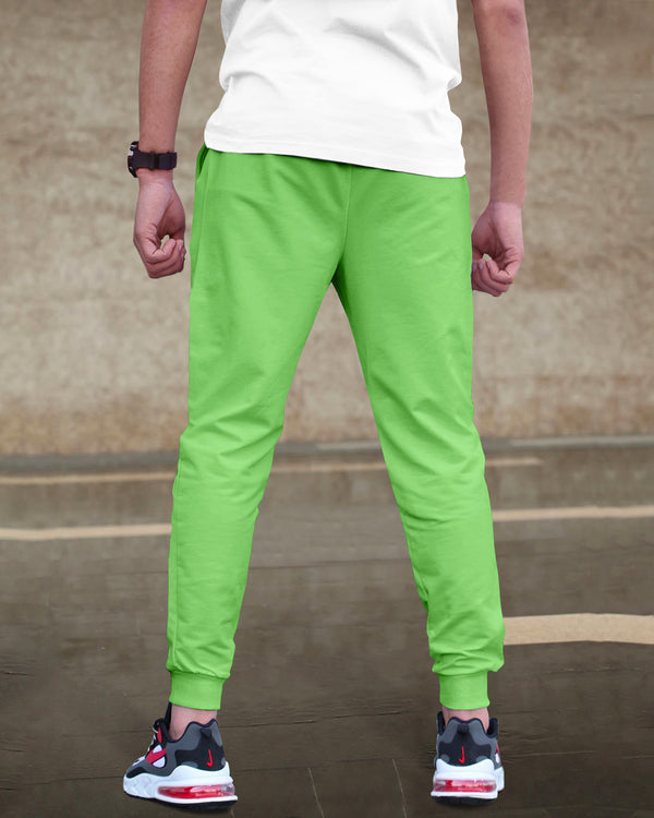 Model wearing newyork word printed apple green cargo pant with sneakers