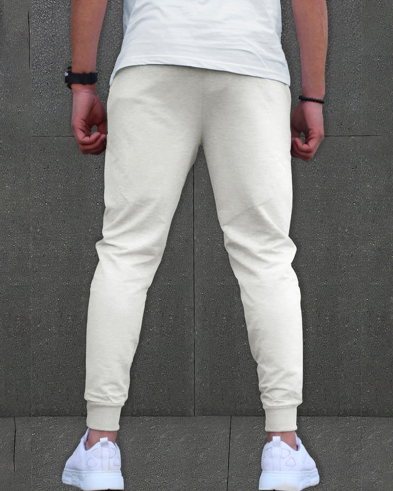 Model wearing zip pocket white cargo pant with white sneakers