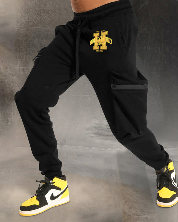 Model wearing HOLLYWOOD word printed black cargo pant with sneakers